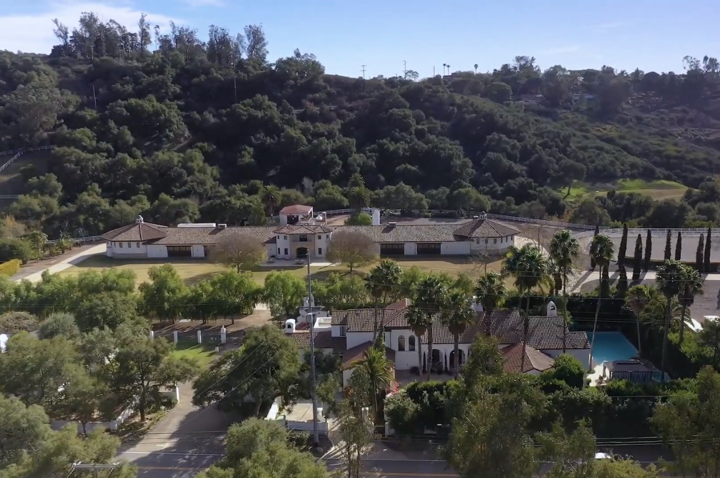 Wide aerial overview of the property and surrounding estates