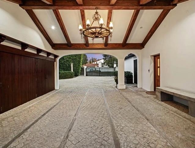 Motor court and porte-cochère with wagon-wheel chandelier